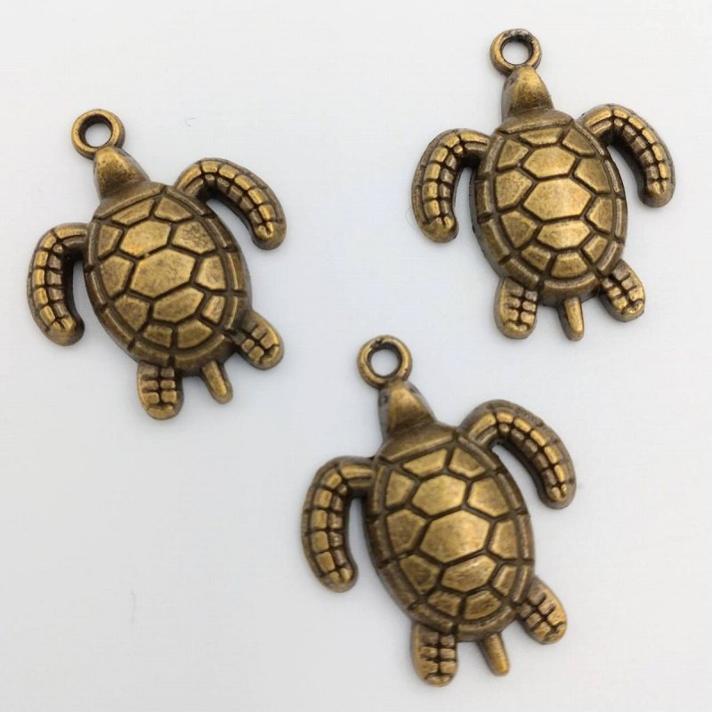 画像1: ビーズクラブ チャーム うみがめ 大 金古美 23mm 10個セット (1)