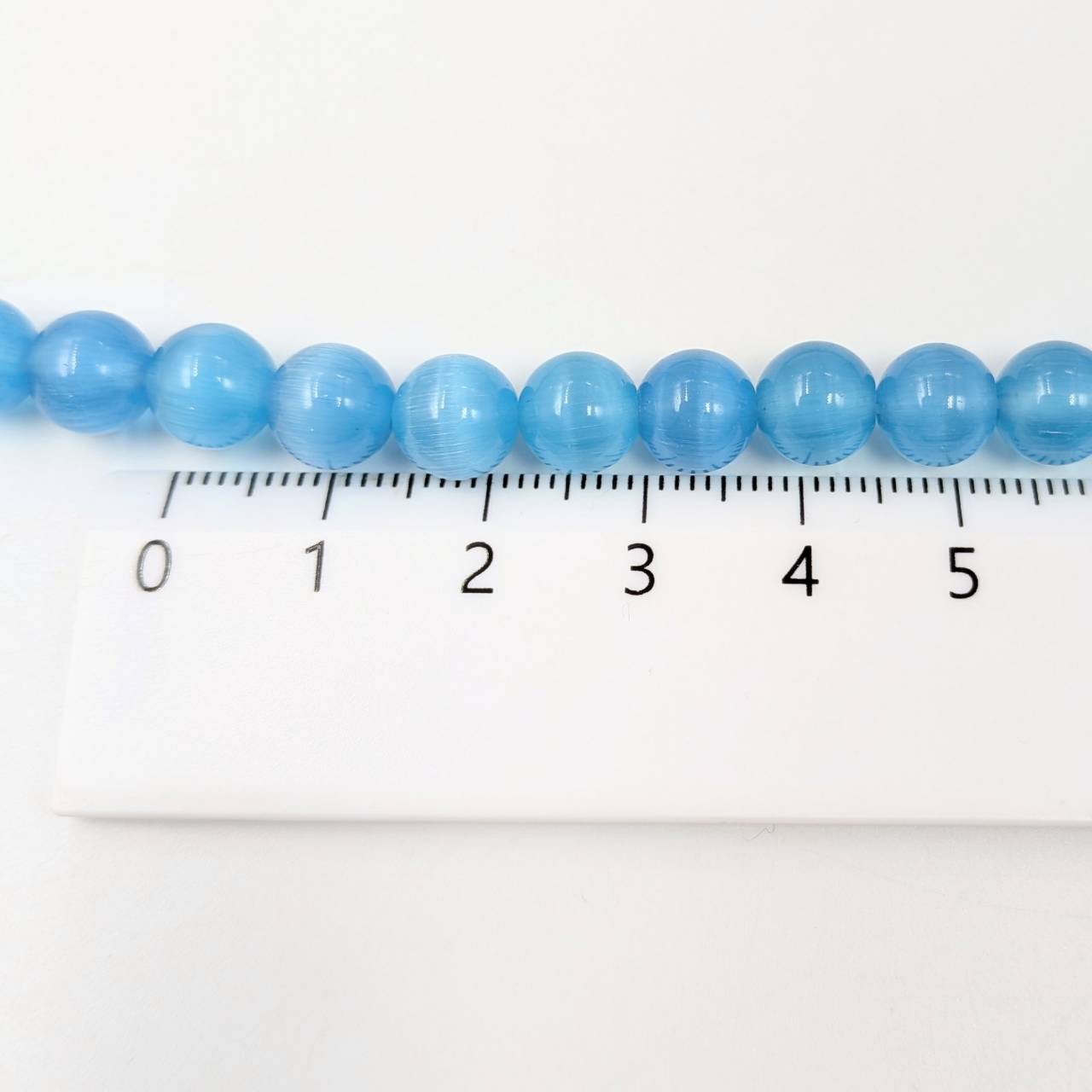 ビーズクラブ キャッツアイ 水色 ラウンド 8mm 連売り